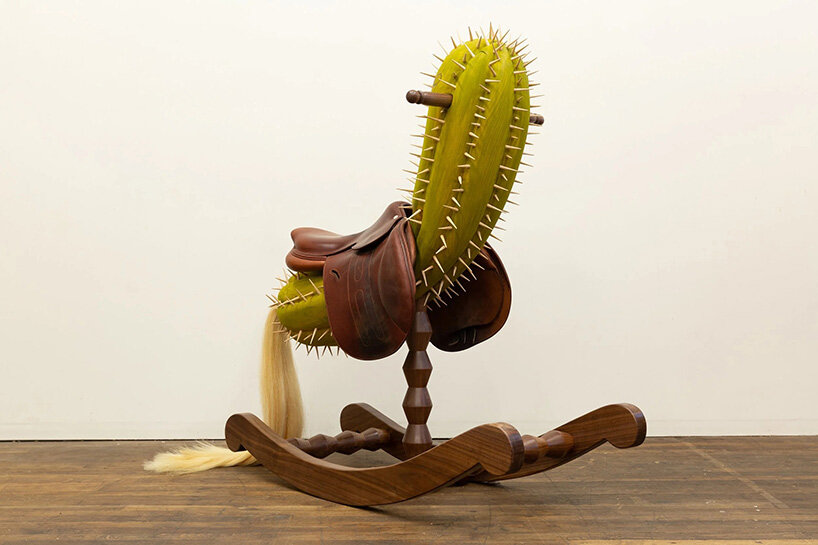raul de lara carves surreal wooden sculptures to question who gets to belong