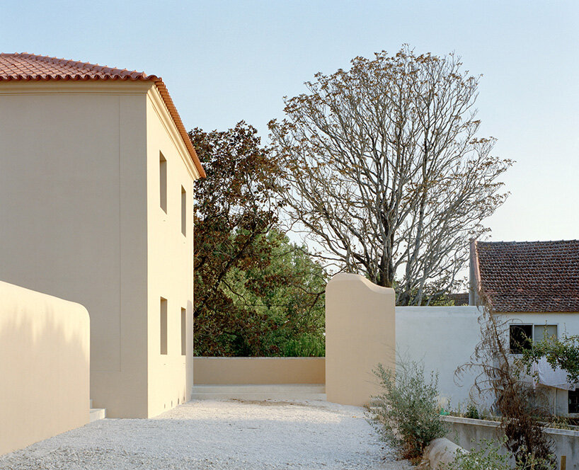 arquitectura-G embeds blue concrete core with spiraling staircase in portuguese residence