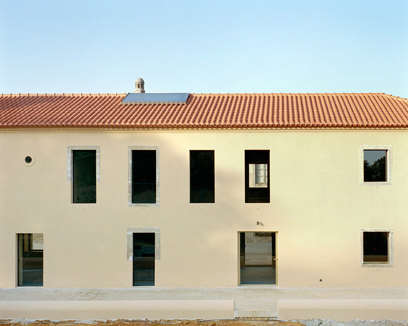arquitectura-G embeds blue concrete core with spiraling staircase in portuguese residence