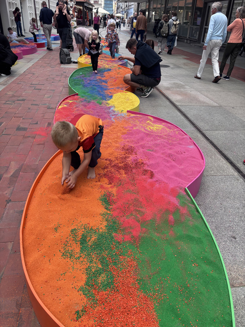 tons of colored aggregates mix together to form color path public art installation in poland