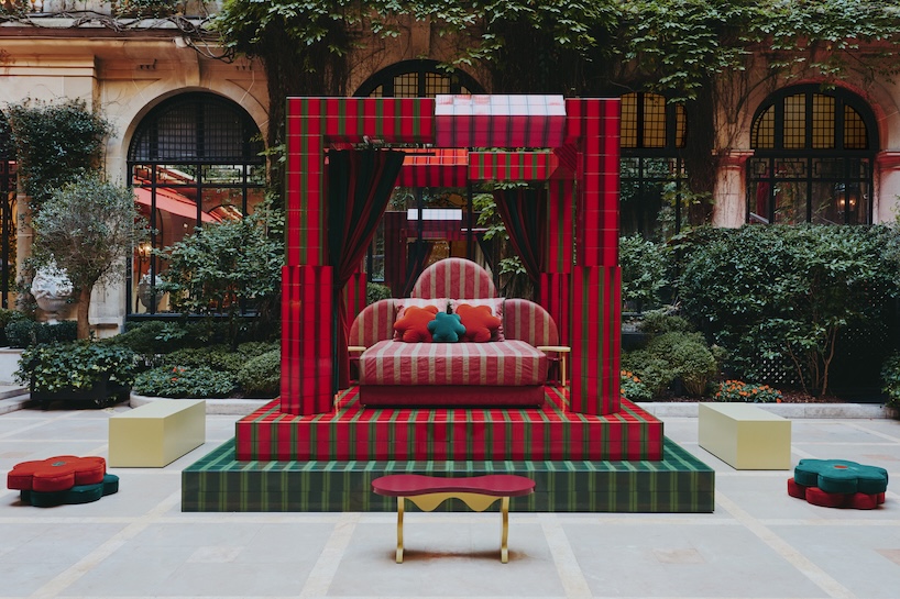 green and red ceramic tiles clad sculptural daybed by uchronia at hôtel plaza athénée, paris
